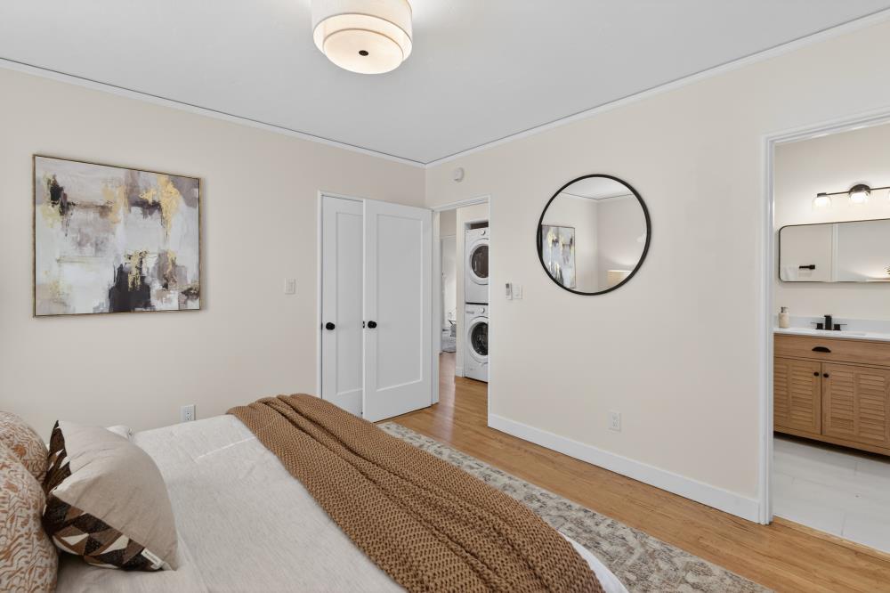 2008 Argail Way Sacramento, CA 95822 - Photo 32 of 53 a bedroom with a bed and a chandelier