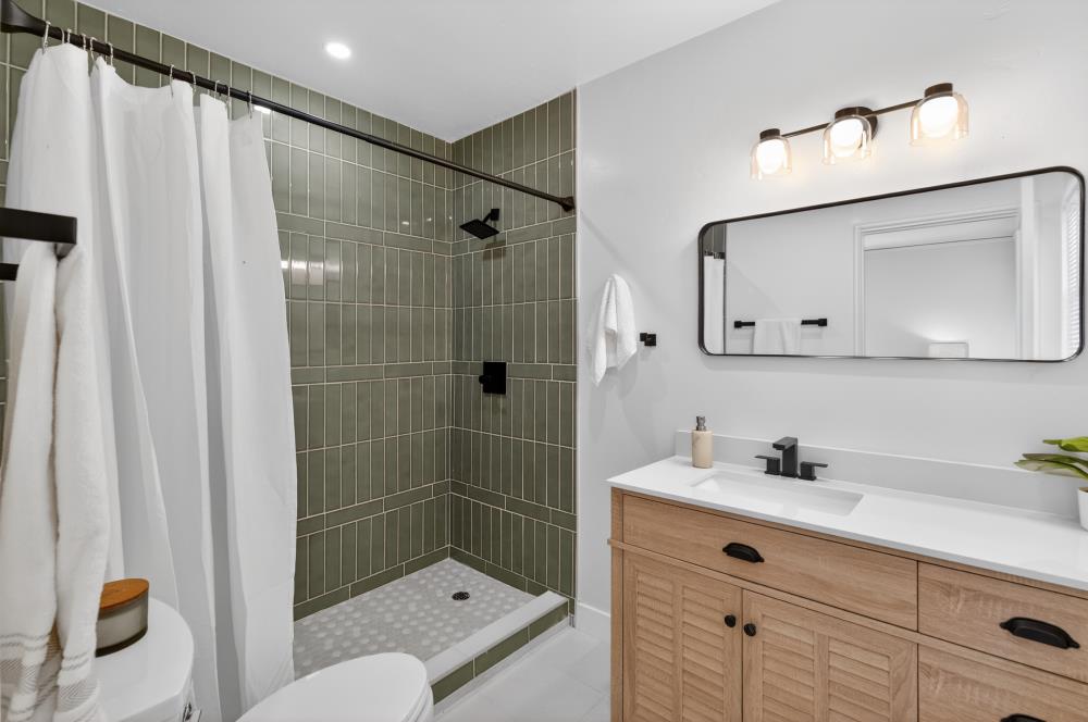 2008 Argail Way Sacramento, CA 95822 - Photo 34 of 53 a bathroom with a shower sink and mirror