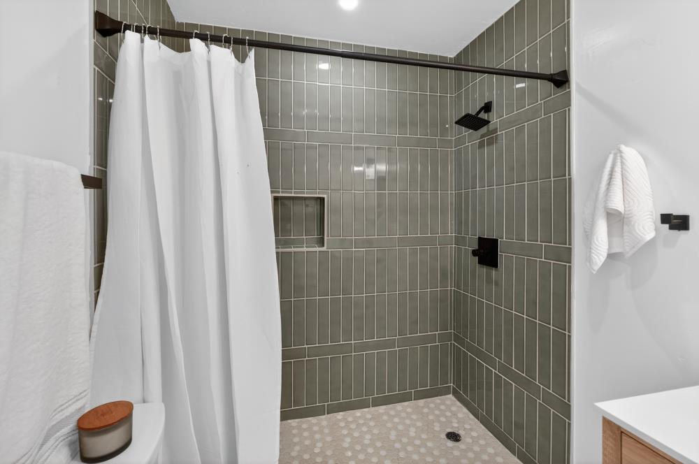 2008 Argail Way Sacramento, CA 95822 - Photo 35 of 53 a bathroom with a shower and a sink