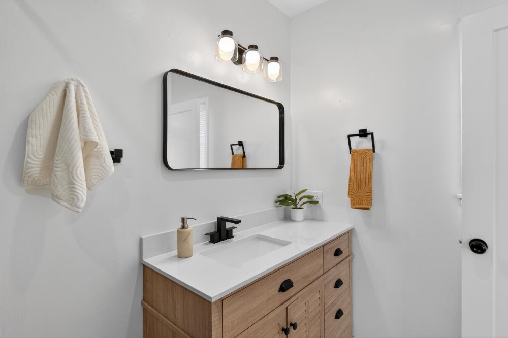 2008 Argail Way Sacramento, CA 95822 - Photo 36 of 53 a bathroom with a sink vanity and mirror