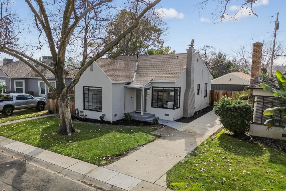 2008 Argail Way Sacramento, CA 95822 - Photo 46 of 53 a front view of a house with a garden and trees