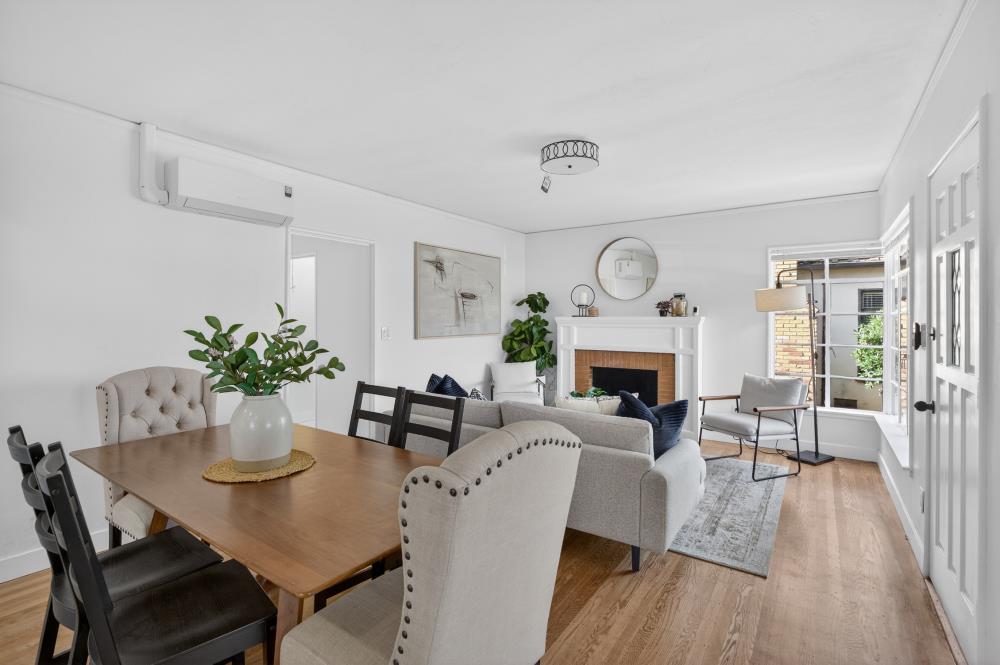 2008 Argail Way Sacramento, CA 95822 - Photo 9 of 53 a living room with furniture a fireplace and a potted plant