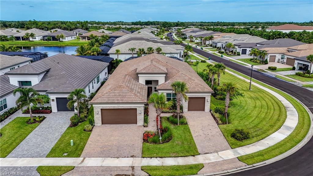 12068 Azalea Way Naples, FL 34120 - Photo 13 of 50 an aerial view of a house