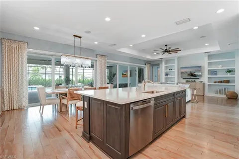 a kitchen with stainless steel appliances granite countertop counter space and wooden floors