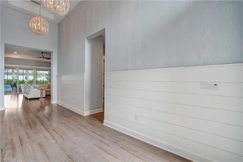 a view of livingroom with hardwood floor and a large window