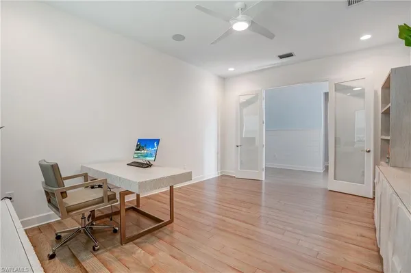 a workspace with furniture and wooden floor