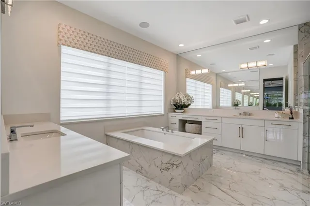 a kitchen with a sink cabinets and window
