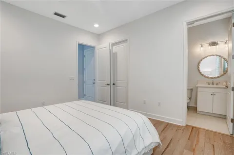 a bedroom with a bed and a dresser