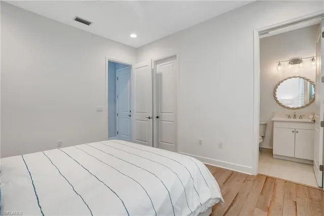 a bedroom with a bed and a dresser