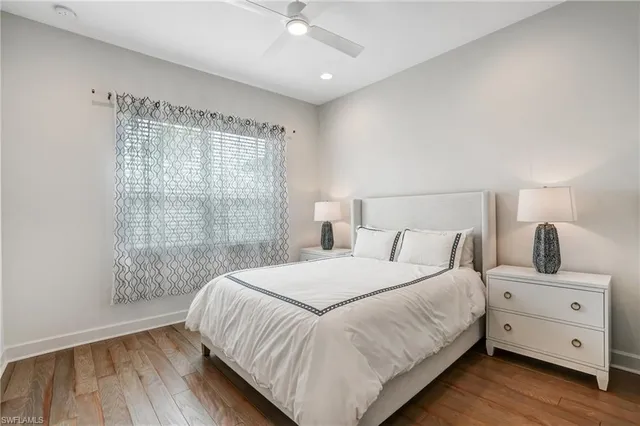 a bedroom with a large bed and a window