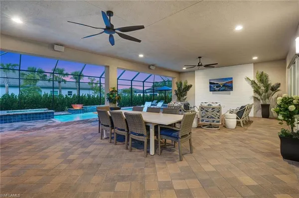 a view of a dining room with furniture window and outside view