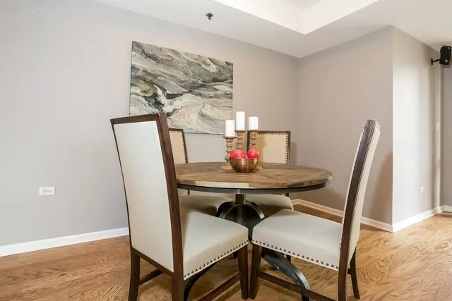 a view of a dining room with furniture and wooden floor