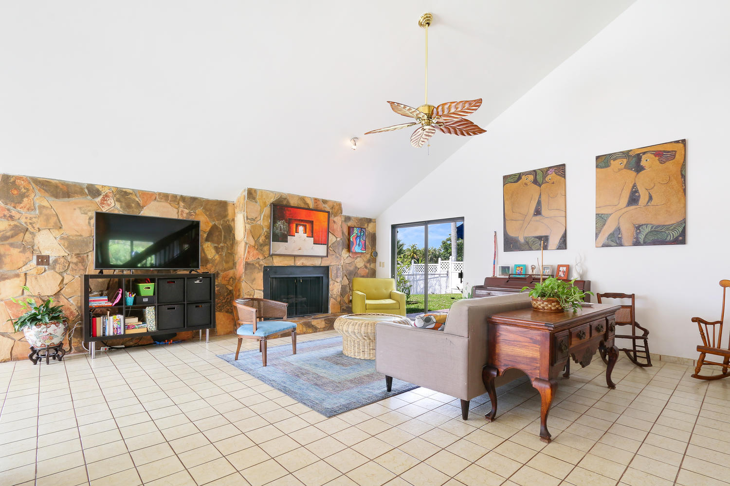 764 Avocet Road Delray Beach, FL 33444 - Photo 10 of 32 Family room with fireplace & patio