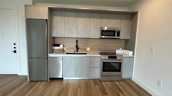 a kitchen with a sink and a microwave