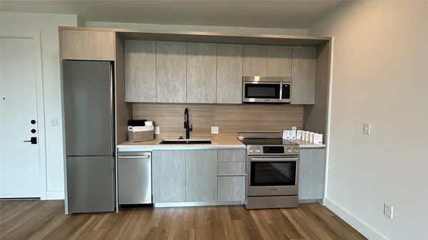 a kitchen with a sink and a microwave