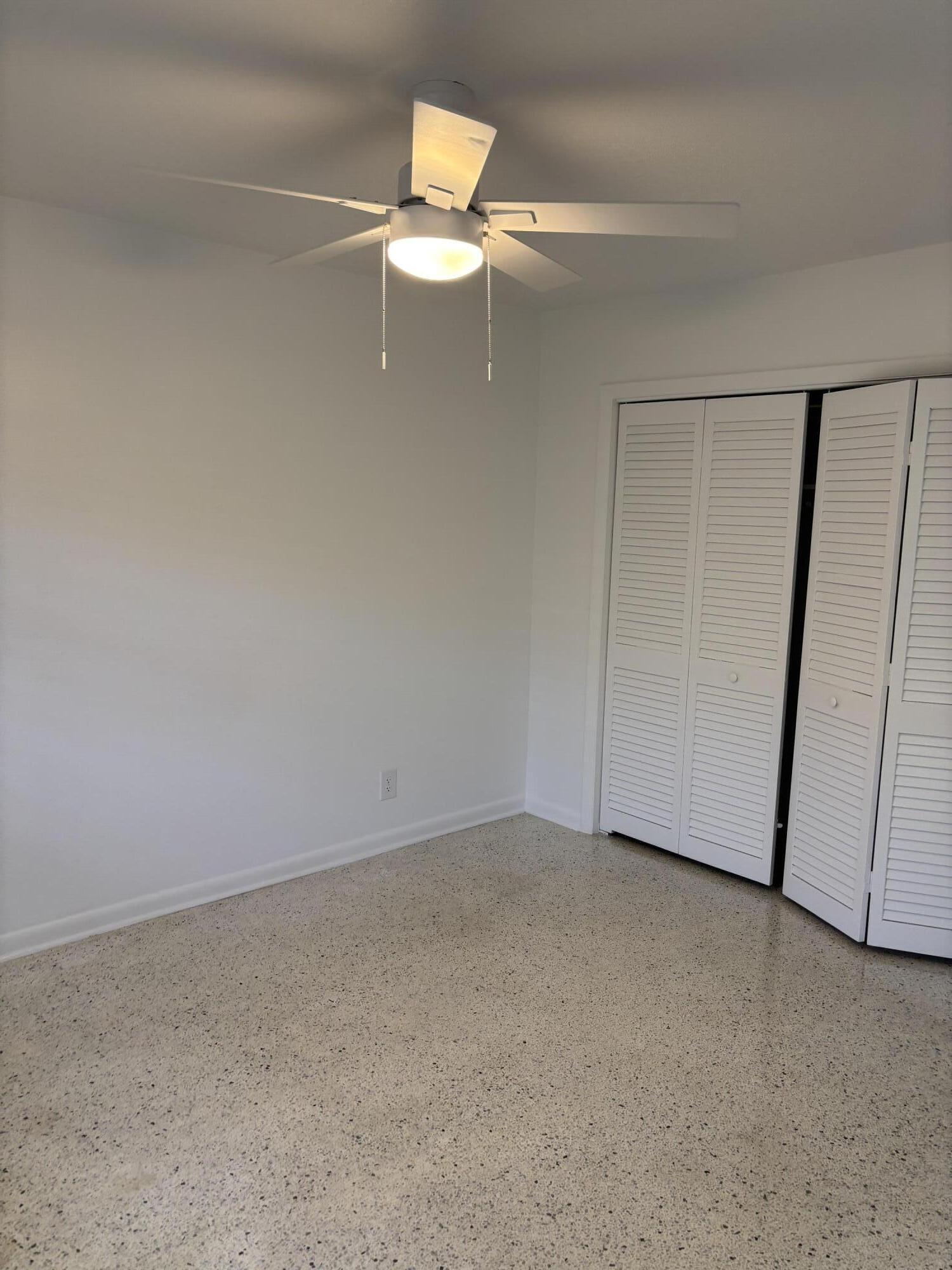 751 Hummingbird Way, Unit 5 North Palm Beach, FL 33408 - Photo 8 of 18 a view of an empty room