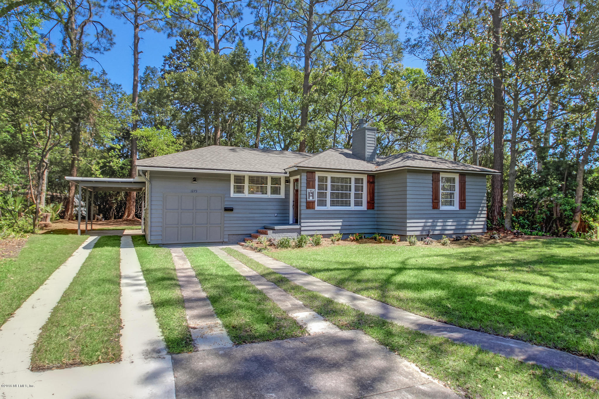 1273 Lechlade Circle Jacksonville, FL 32205 - Photo 1 of 23 a front view of a house with a yard