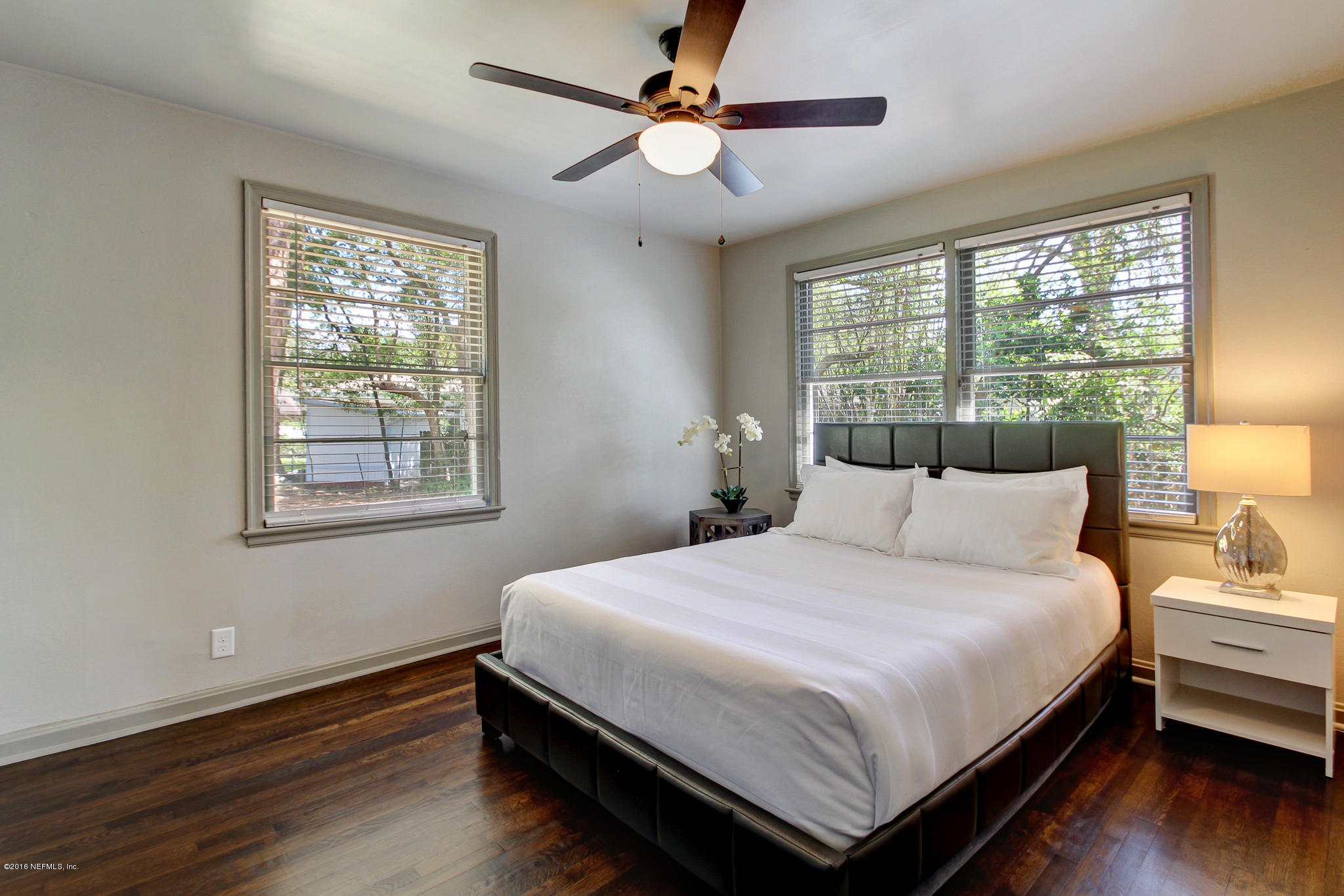 1273 Lechlade Circle Jacksonville, FL 32205 - Photo 12 of 23 a bedroom with a bed wooden floor and window