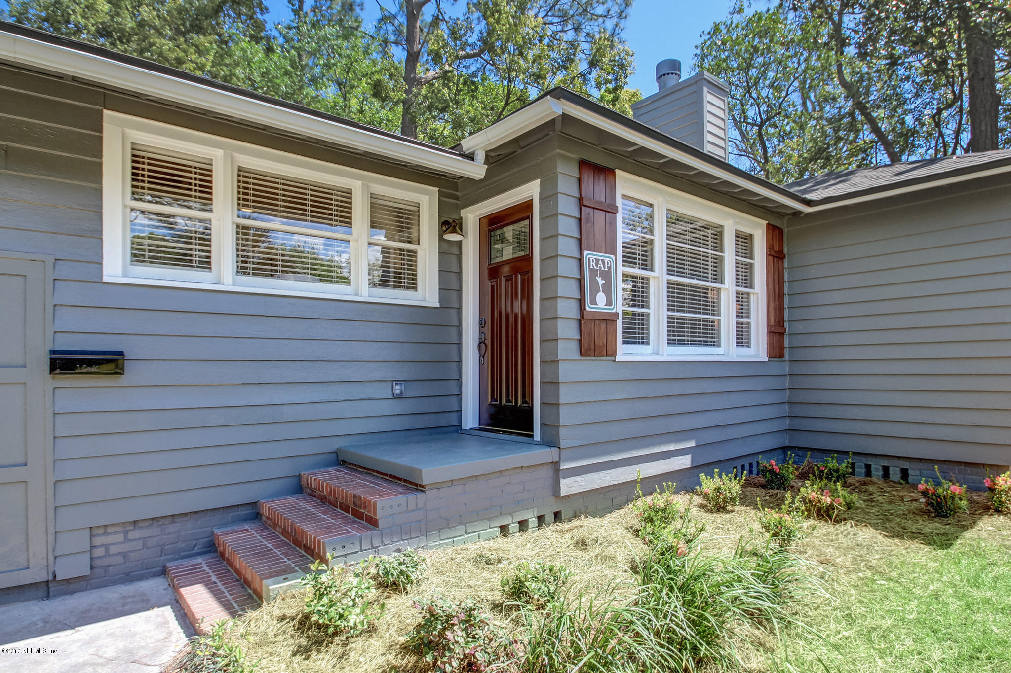 1273 Lechlade Circle Jacksonville, FL 32205 - Photo 2 of 23 a front view of a house with a yard