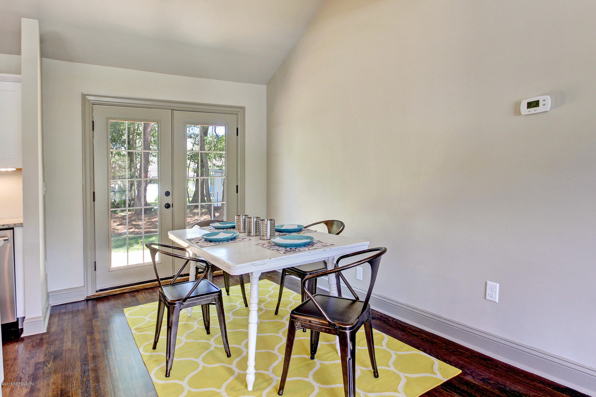 1273 Lechlade Circle Jacksonville, FL 32205 - Photo 6 of 23 a view of a dining room with furniture and wooden floor