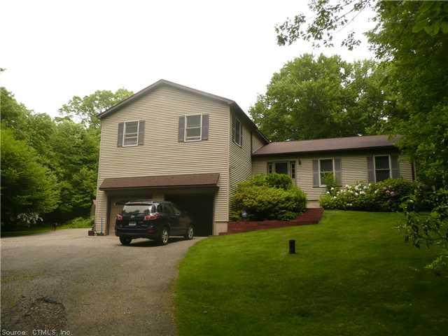 50 Lavander Road Barkhamsted, CT 06063 - Photo 1 of 1 a front view of a house with a garden and yard