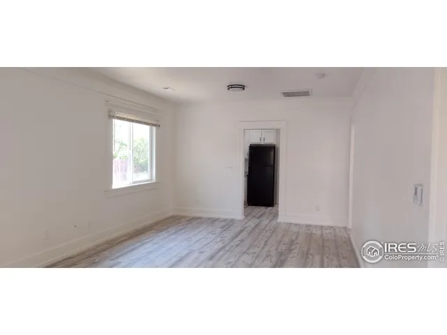 a spacious bathroom with a sink and a mirror