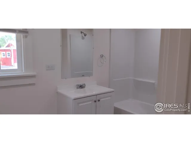 a bathroom with a toilet a sink and bathtub