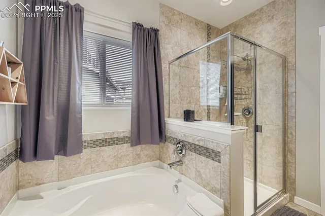 a bathroom with a tub and a sink