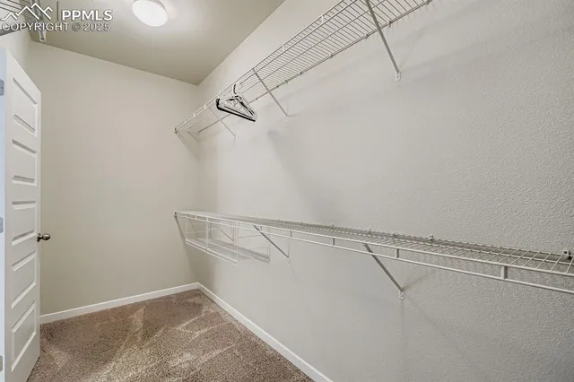 a view of a room with racks on the wall