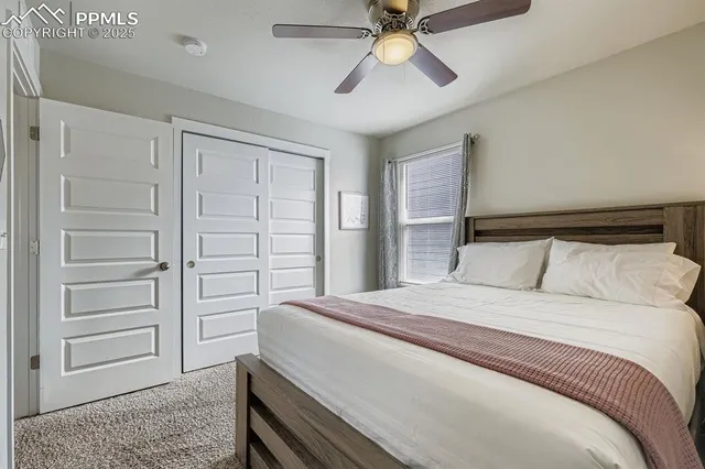 a bedroom with a bed and closet