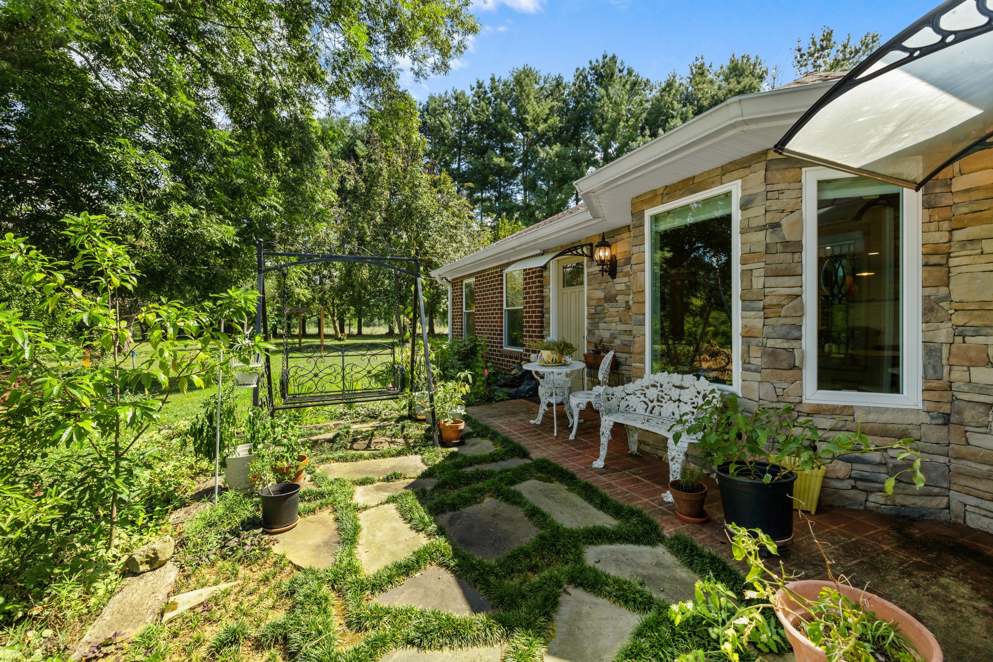 1556 Chestnut Grove Road Morrison, TN 37357 - Photo 3 of 58 a view of a house with backyard sitting area and garden