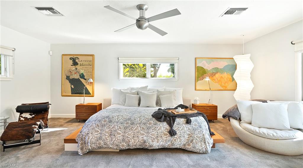 586 Yucca Road Naples, FL 34102 - Photo 11 of 26 Carpeted bedroom with ceiling fan