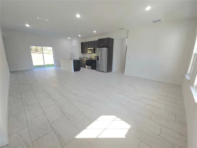 a view of kitchen and a window