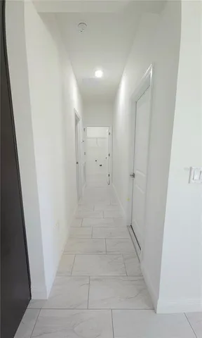 a view of hallway with shower