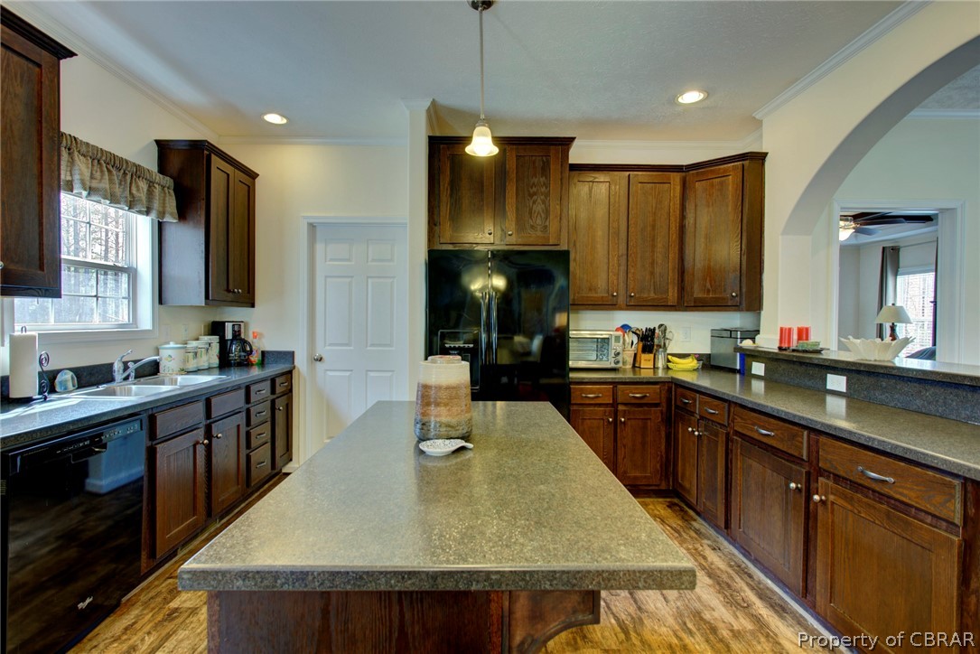 1496 Elsom Mascot Road Mattaponi, VA 23110 - Photo 10 of 33 a kitchen with kitchen island granite countertop wooden cabinets a sink and a stove