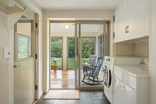 a view of storage and utility room with washer and dryer