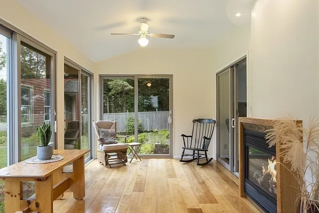 a living room with furniture and a floor to ceiling window