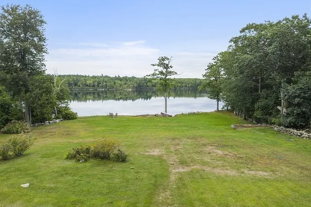a view of a lake in a field