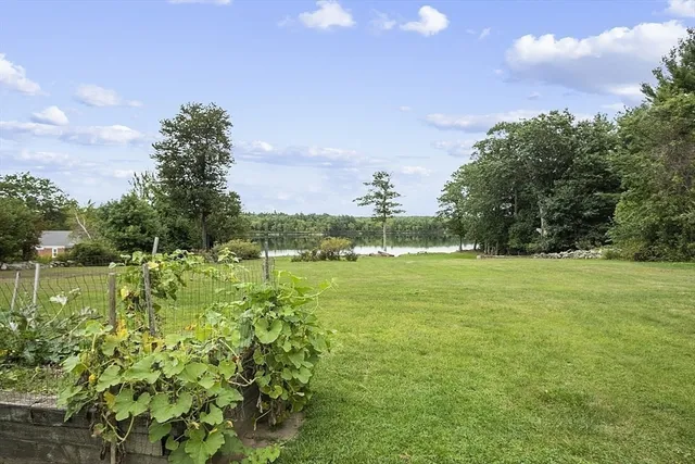 a view of a lake with a yard