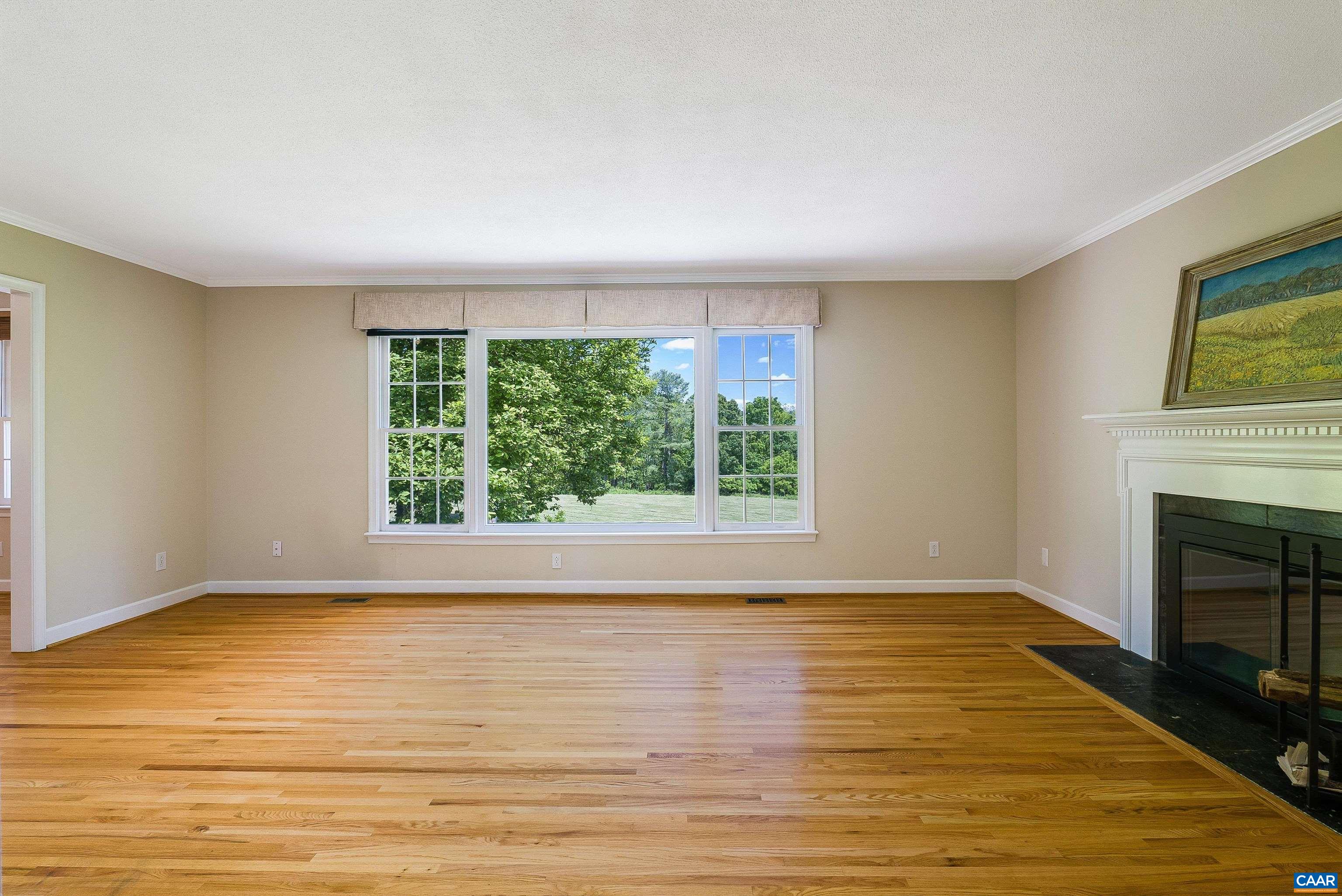 1571 Duke Road Waynesboro, VA 22980 - Photo 12 of 75 a view of empty room with wooden floor and fireplace