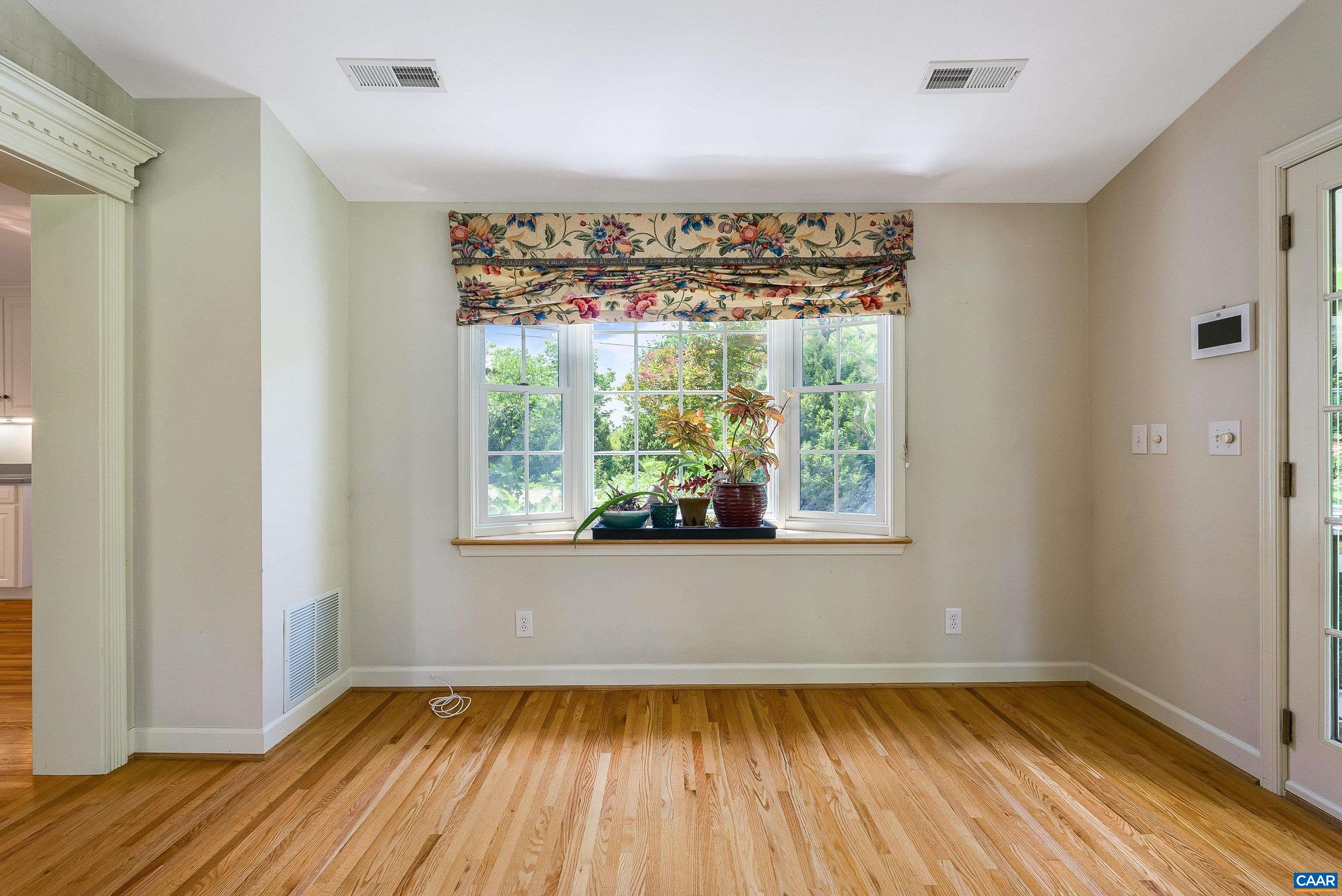 1571 Duke Road Waynesboro, VA 22980 - Photo 21 of 75 an empty room with wooden floor and a window