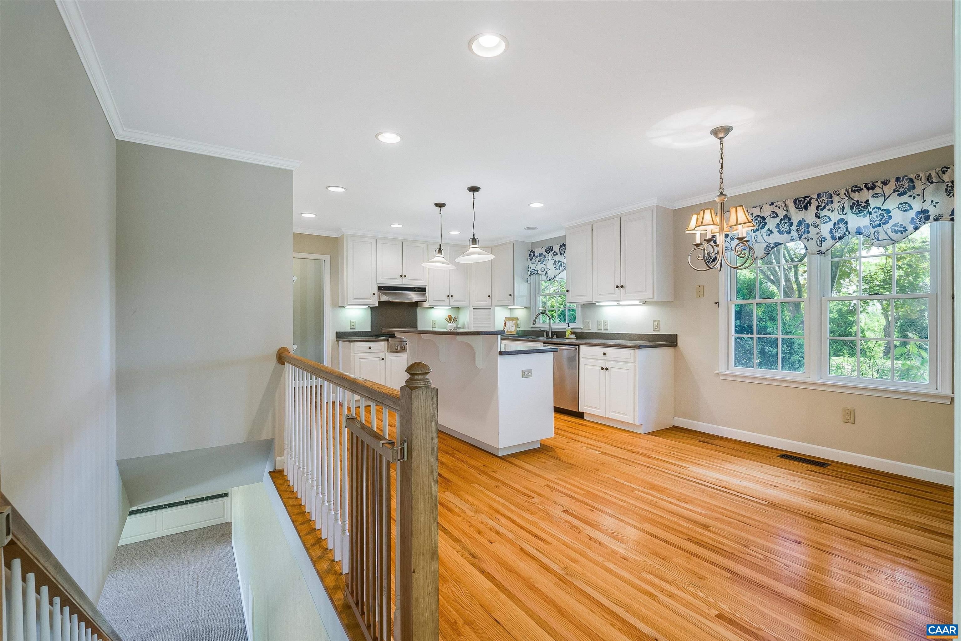 1571 Duke Road Waynesboro, VA 22980 - Photo 36 of 75 a kitchen with kitchen island granite countertop a sink stove and wooden floor