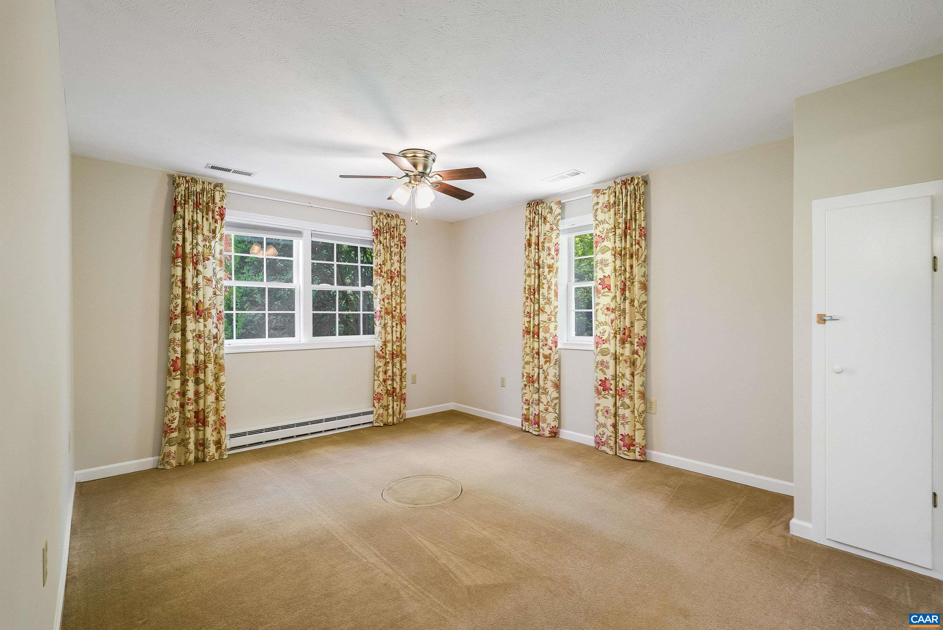 1571 Duke Road Waynesboro, VA 22980 - Photo 47 of 75 an empty room with windows chandelier fan and windows