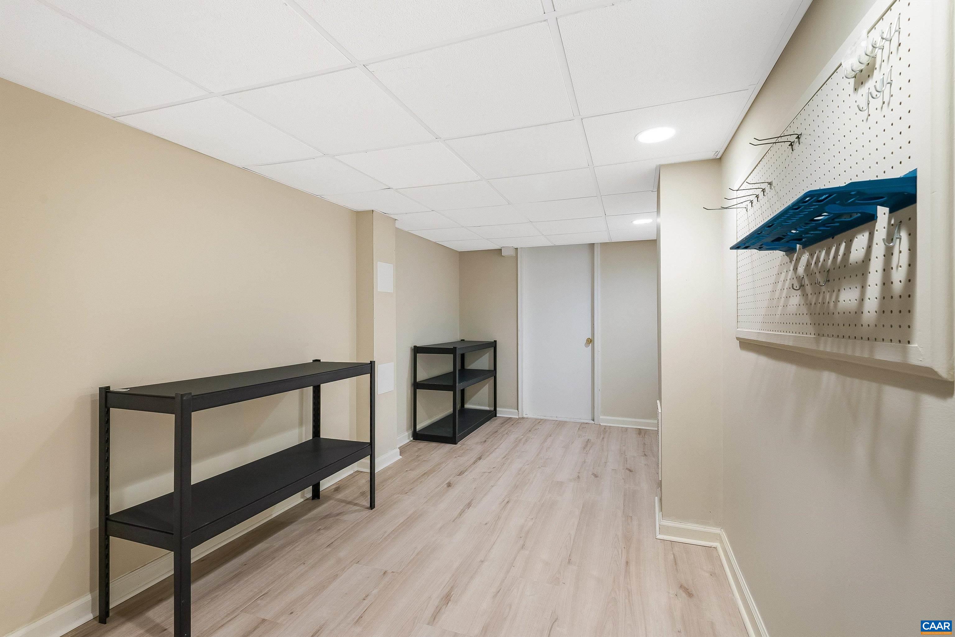 1571 Duke Road Waynesboro, VA 22980 - Photo 49 of 75 a view of a hallway with wooden floor and a bathroom