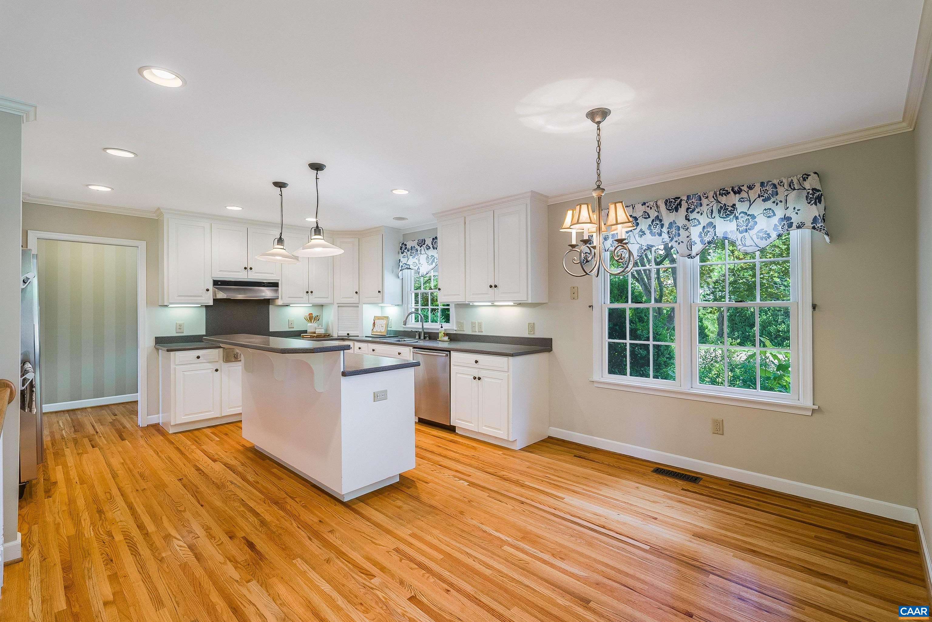 1571 Duke Road Waynesboro, VA 22980 - Photo 10 of 75 a kitchen with stainless steel appliances granite countertop a refrigerator a sink dishwasher a stove and white cabinets with wooden floor