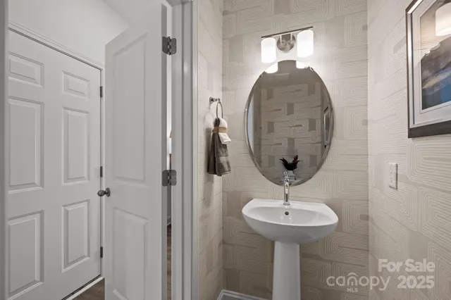 a room with a sink and a mirror