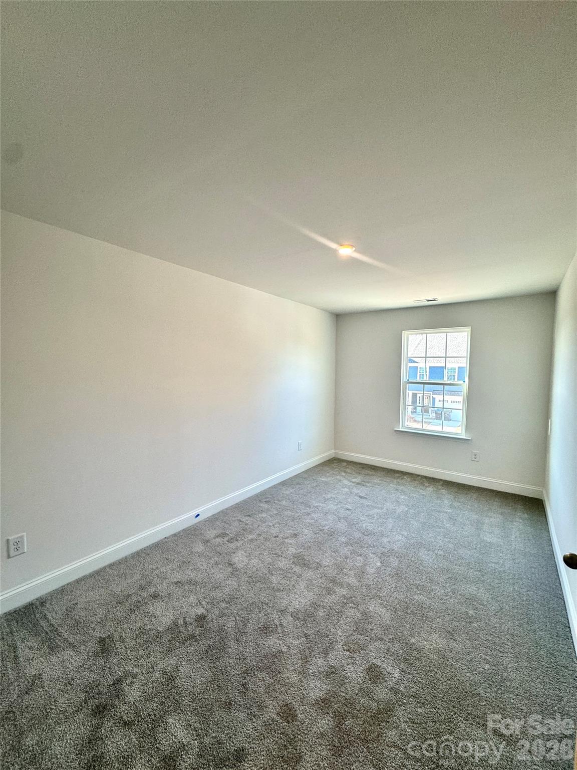 7709 Ethora Way Charlotte, NC 28216 - Photo 22 of 33 an empty room with a window