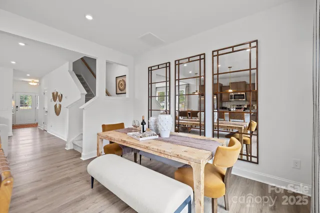 a dining room with furniture and wooden floor