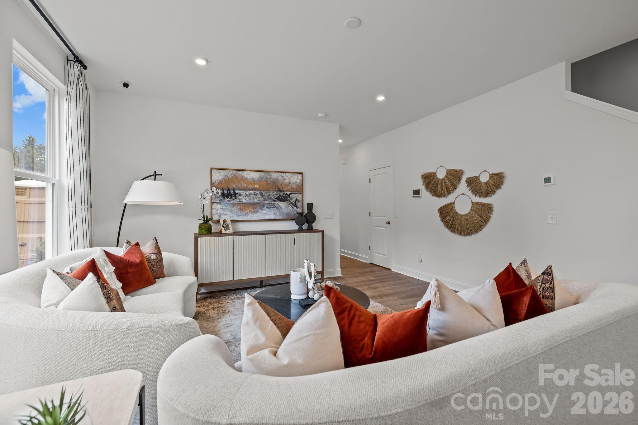 7709 Ethora Way Charlotte, NC 28216 - Photo 7 of 33 a living room with furniture and a couch