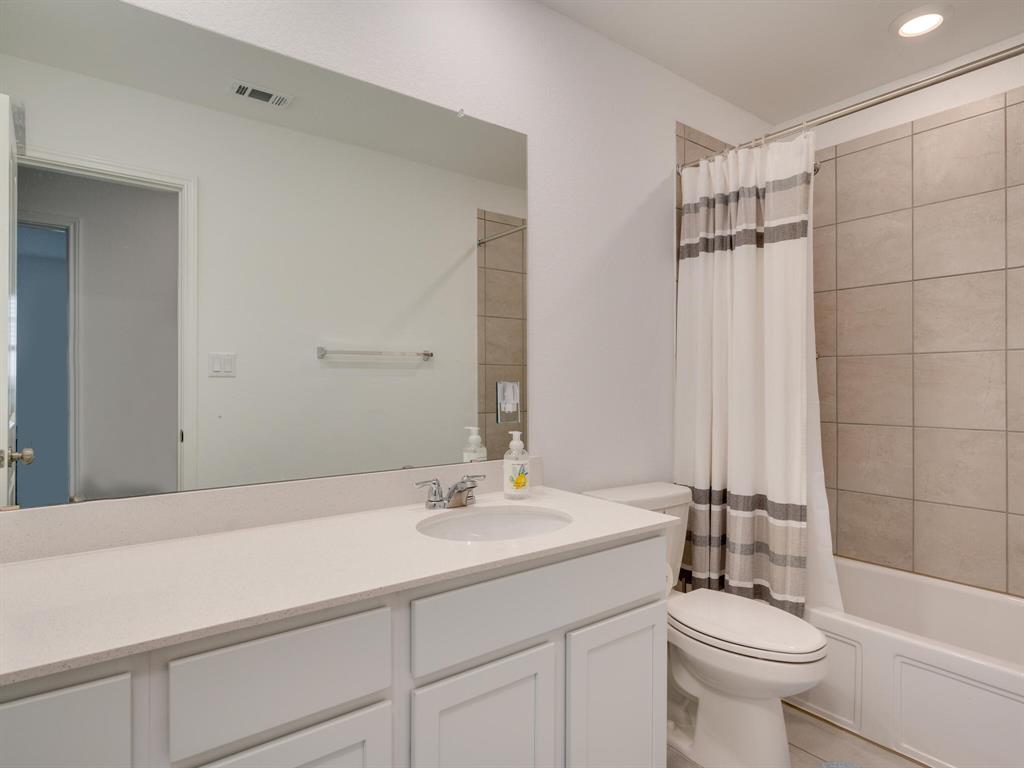 1208 Sweetspire Street Leander, TX 78641 - Photo 27 of 36 Bathroom featuring a white vanity with a light-toned countertop, an integrated sink, and chrome fixtures